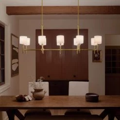 Ali 10-Light Brushed Natural Brass Traditional Dining Room Linear Chandelier with White Fabric Shades by KICHLER -Kichler Sales brushed natural brass kichler chandeliers 52503bnb 1d 1000