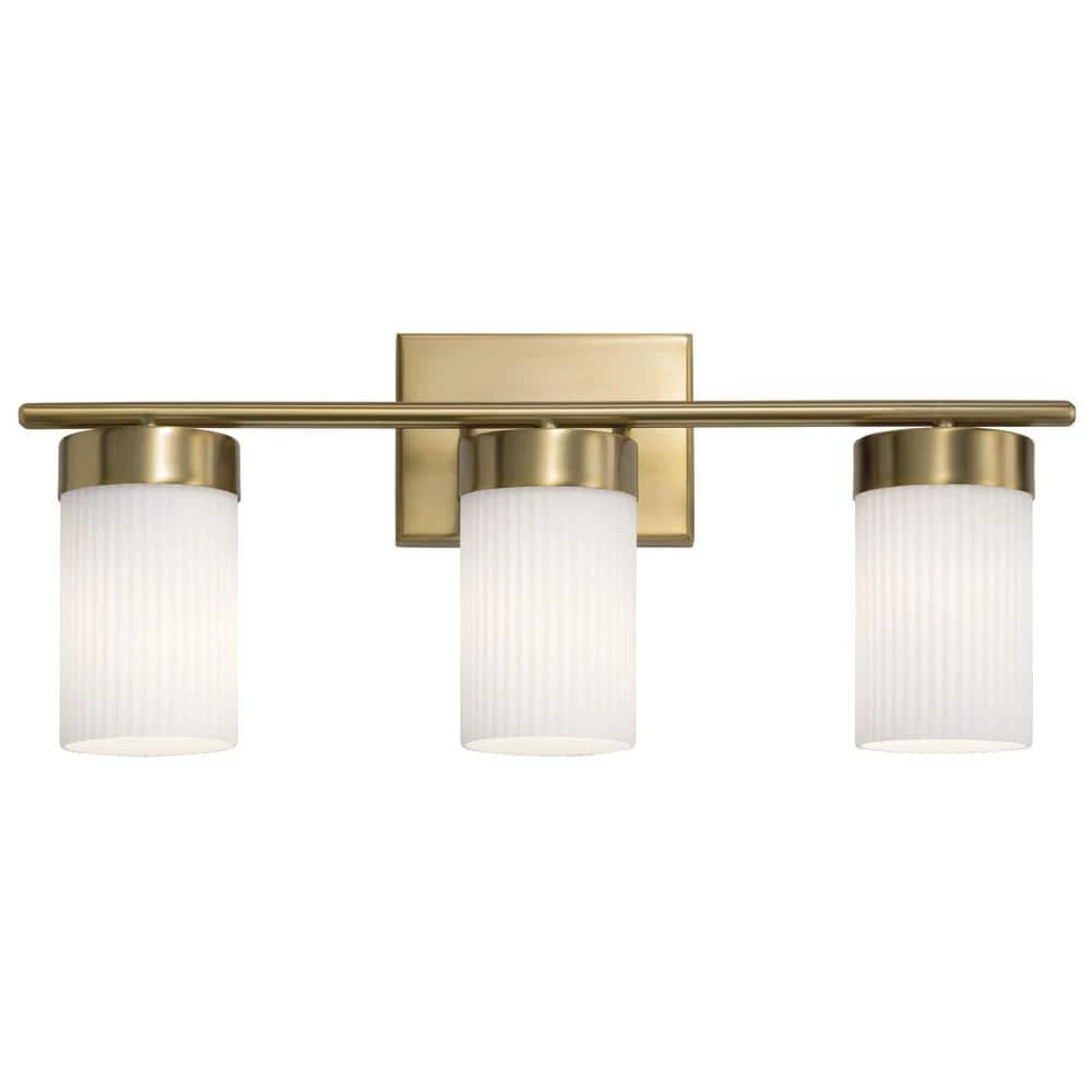 Ciona 24 in. 3-Light Brushed Natural Brass Bathroom Vanity Light with Round Ribbed Glass by KICHLER 6 Ciona 24 in. 3-Light Brushed Natural Brass Bathroom Vanity Light with Round Ribbed Glass by KICHLER - Image 4